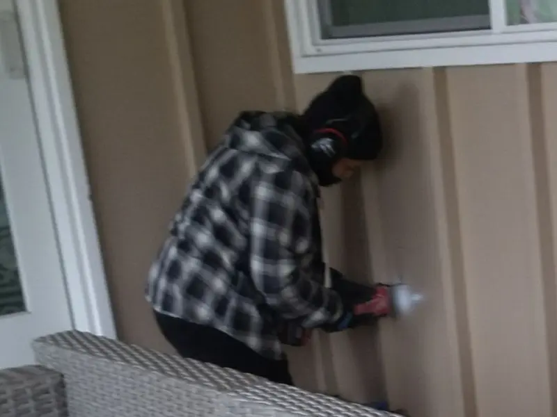 Professional electrician installing an exterior outlet in Griffith